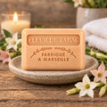 Tobacco Flower 125g French soap with delicate flowers on a rustic soap dish