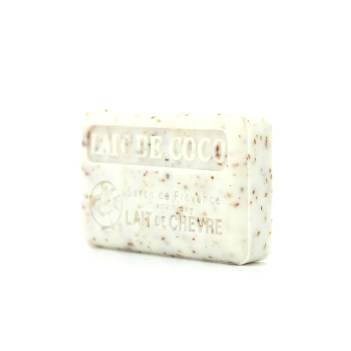 A rectangular bar of speckled white and beige hair conditioner soap with embossed text reading 'LAIT DE COCO' and 'LAIT DE CHEVRE' on a plain white background.