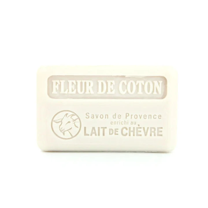 A rectangular bar of off-white goat milk soap with embossed text reading 'FLEUR DE COTON' and 'Savon de Provence enrichi au LAIT DE CHÂVRE', on a plain white background.