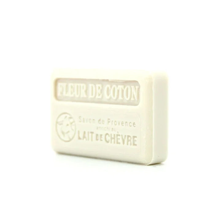 A rectangular bar of French lait de chevre soap with 'FLEUR DE COTON' embossed on the top, set against a plain white background.
