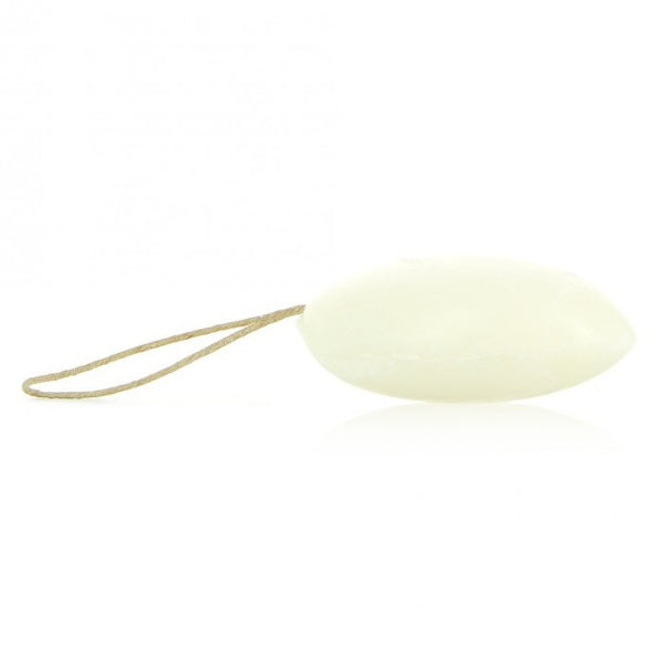 A white, oval-shaped soap bar with a thin beige string loop, shown on a plain white background.