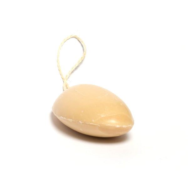 A small, smooth, pale yellow-coloured stone ornament with a natural fibre hanging loop, shown on a plain white background.