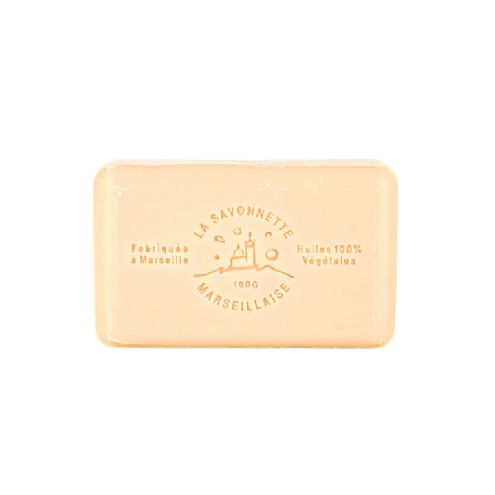 A rectangular bar of pale peach-colored Marseille soap with embossed text reading 'LA SAVONNETTE' and 'MARSEILLAISE' on a plain white background.